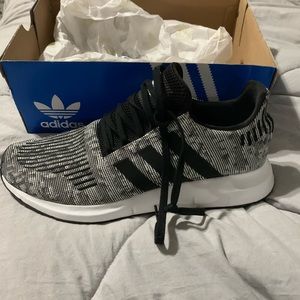 Brand new Adidas.  11.5 men’s.